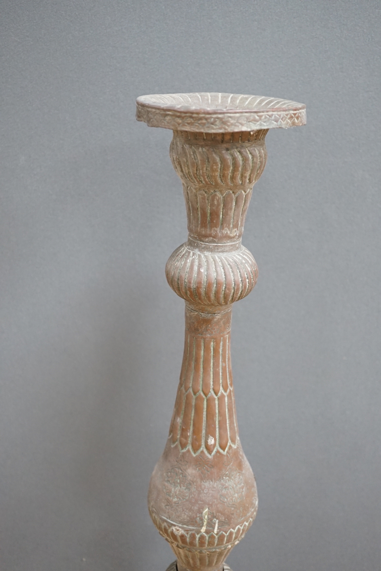 An Islamic copper candle stand, 19th/early 20th century, 97cm high